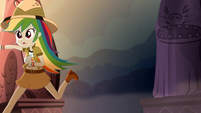 Rainbow Dash running toward the statues SS12