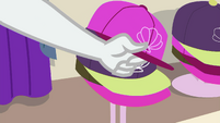 Rarity grabbing pink hat off the rack EGSB