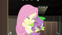 Fluttershy hugs and nuzzles Spike the dog EGS2