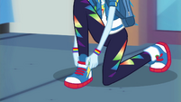 Rainbow tightening her sneakers EGDS42