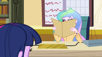 Principal Celestia with her face in a folder EG