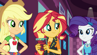 Sunset Shimmer happily holding her new game EGDS2