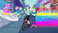Rainbow standing beside the bicyclist EGDS42