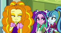 The Dazzlings give each other sly looks EG2