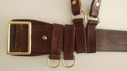 A detailed view of the belt buckle, the buckling knob, twin hand grenade rings and strap loops, which are essentially the same hand grenade rings turned upside down and linked to the strap.