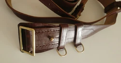 Another closer view of the belt buckle and hand grenade rings, with engraved production site and year markings (Napredak Čačak 76) clearly visible beside the buckling knob.