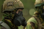A British soldier from 20th Armoured Infantry Brigade wearing an Mk 7 Helmet with cover and General Service Respirator during CBRN Exercise Poison Fist in September, 2014[10]