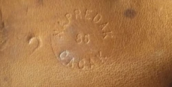Markings from the "Napredak Čačak" made belt, Positioned underneath the belt buckle. The number 86 stands for the year of manufacture, while the number 2 marks its size.