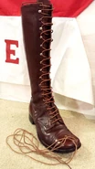 Another boot with modern laces (original laces on the floor)