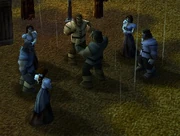 Robert y Tyler peleando en medio de un grupo de aldeanos.