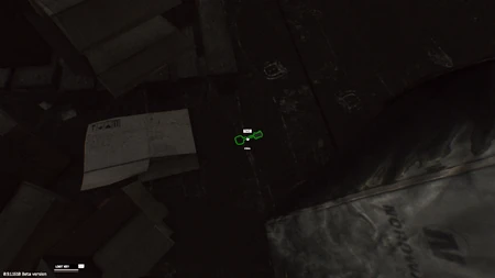 Key on a book near box, behind the 2 tents