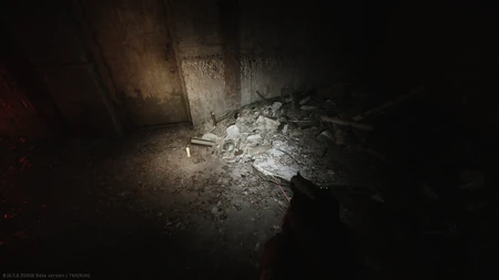 On a metal bar in the rubble