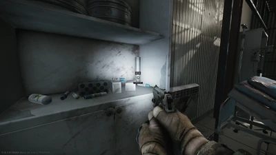 Fifth spawn on the left-side shelves, on the bottom shelf