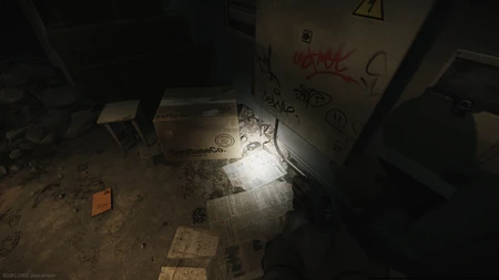 Second journal spawn: Next to a package in the back right, under the rubble