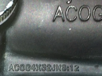 TA01-NSN featuring the full inscription "ACOG4X32JN8:12"