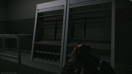 The weapon racks with 3 MP5 on them.