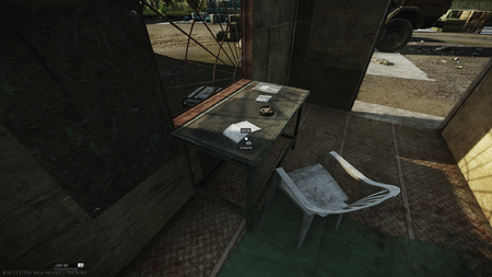 Second spawn: On the desk inside the red container next to the northwestern warehouse