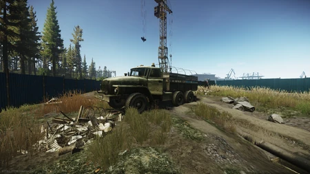 The second UN truck is located at the construction site along the southern main road, near the crane.