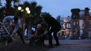 Joey, Oli White, and Eva Gutowski burying the Artifacts.