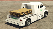 Utility Truck con caja de madera visto de atrás.