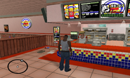 CJ, dentro de un Burger Shot, GTA: SA.