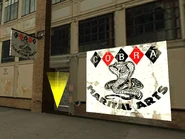 Martial arts1.jpg (70 kB) El gimnasio Cobra Marital Arts. Nótese el error en el nombre en el cartel