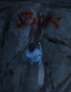 La palabra "Jock" escrito en sangre.