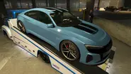 Omnise-GT-GTAOee-PrizeRide-May2025-NoAd.webp (587 kB) El Omnis e-GT que aparece como premio del podio en el club de coches de ls en la Semana de Director Ejecutivo (Mayo 2025).