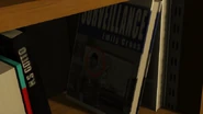 LibroCJGTAV.png (275 kB) El libro con la imágen de Carl Johnson, en la Casa de Lester Crest.