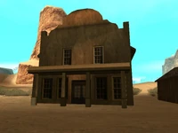 El otro local del lugar (probablemente un banco).