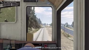 Trevor conduciendo el tren.
