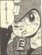 Rockman tomando una lata de energía en "La Fortaleza de Blues ¡Acometida!" del manga "Rockman 5".