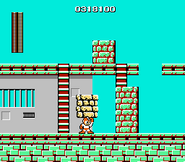 Mega Man utilizando el Super Arm en "Mega Man", NES.