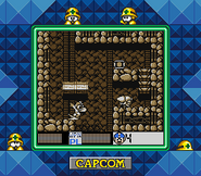 Mega Man utilizando el disparo cargado incompleto del Break Dash en "Mega Man V", Super Game Boy.