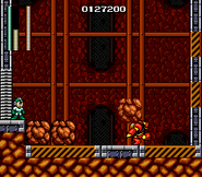 Guts Man usando el Super Arm en "Mega Man: The Wily Wars/Mega Man", Sega Genesis.