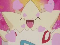 Togepi de Misty usando encanto...