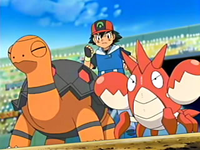 Torkoal junto el Corphish de Ash.