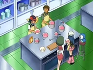 EP553 Cocinando.png (78 kB) Vista de la cocina. Aunque parece pequeña, es probable que esa sólo sea una parte de ella, teniendo en cuenta el tamaño del resto de la mansión.