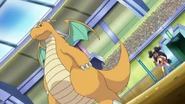 Dragonite junto a Iris.