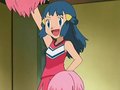 Dawn/Maya con su traje de animadora para apoyar a Ash en sus combates de gimnasio.