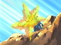 Magmar de Gary usando llamarada contra el Heracross de Ash.