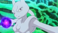 Mewtwo usando bola sombra contra Pikachu de Ash.