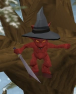 El imp escondido en el árbol