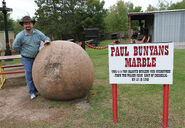 Devin poses with Paul Bunyan's Marble