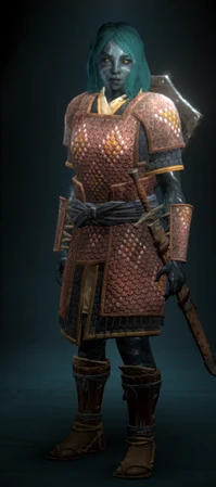 A female soldier, protected by leather lamellar armor worn over a short-sleeved jacket and tunic.