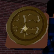 A gold coin in a player's hand.