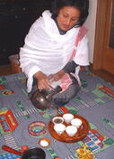 Habesha woman filling coffee cups