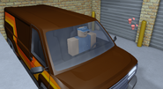 Bobo in a van in one of the garages.