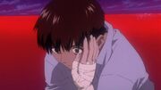 Shinji, again surprised as Asuka caresses him, as if accepting him. This seems to wake him up from his stupor.