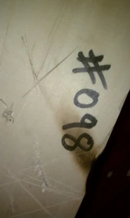You can see four arrows pointing towards the center of the box. EMH logo?